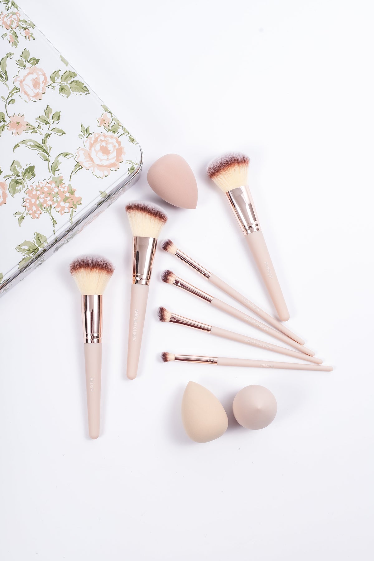 Vintage Watercolor 10-piece makeup brushes and blenders laid out beside floral tin, COQ5155