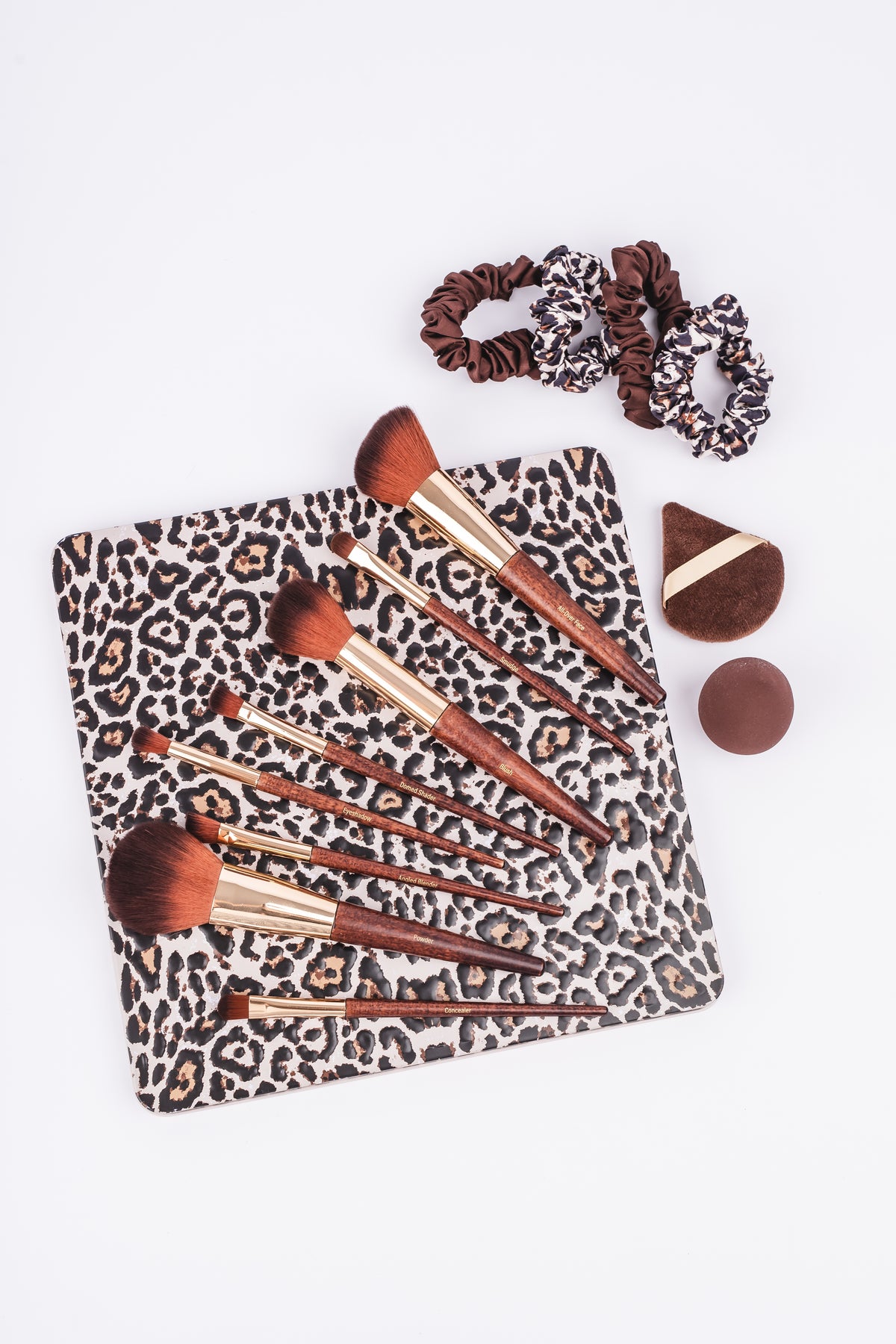 OL1225 leopard tin with brushes, one blender, powder puff and scrunchies