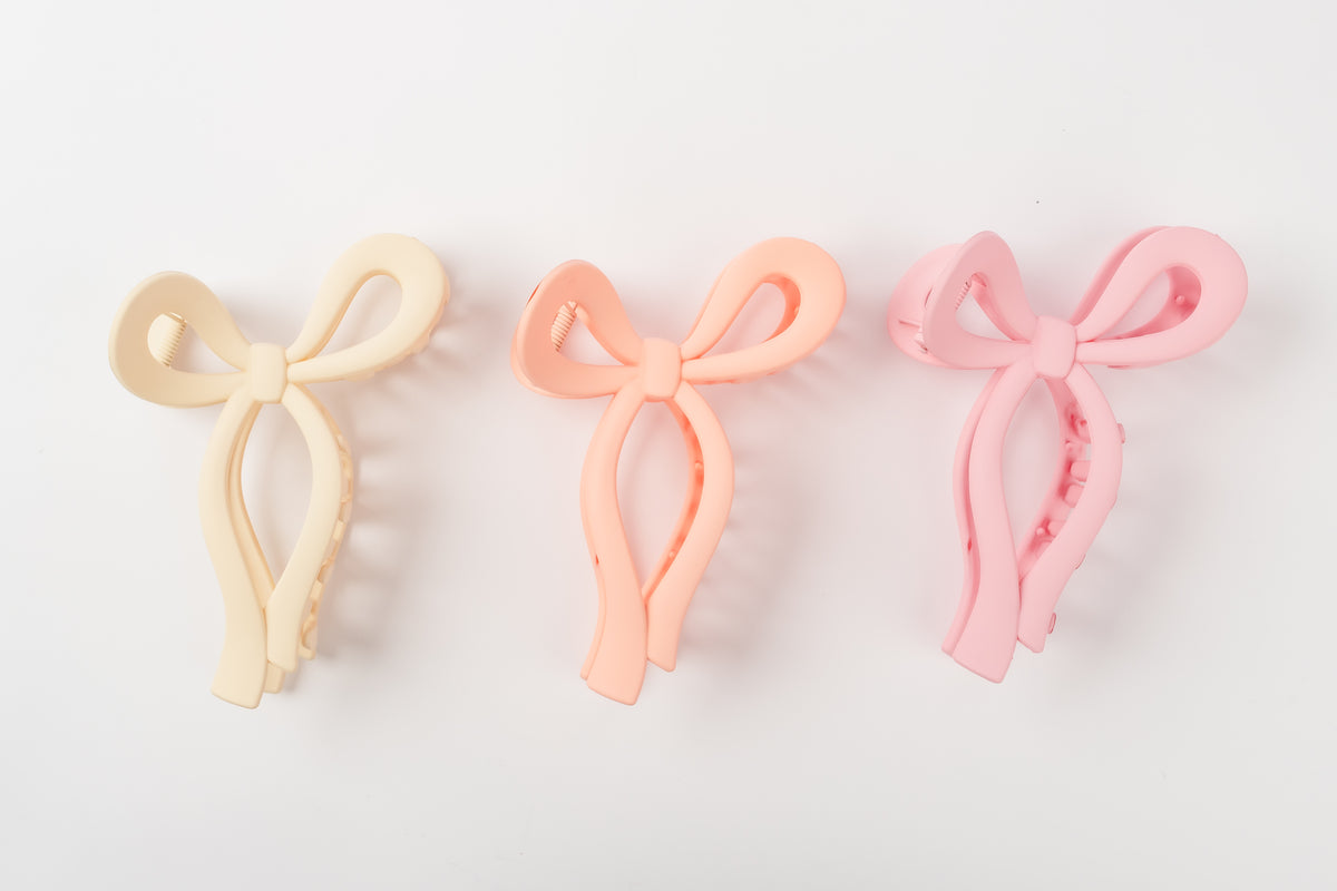 Coquette Couture COQ984 three bow hair clips in ivory, peach and pink, front view