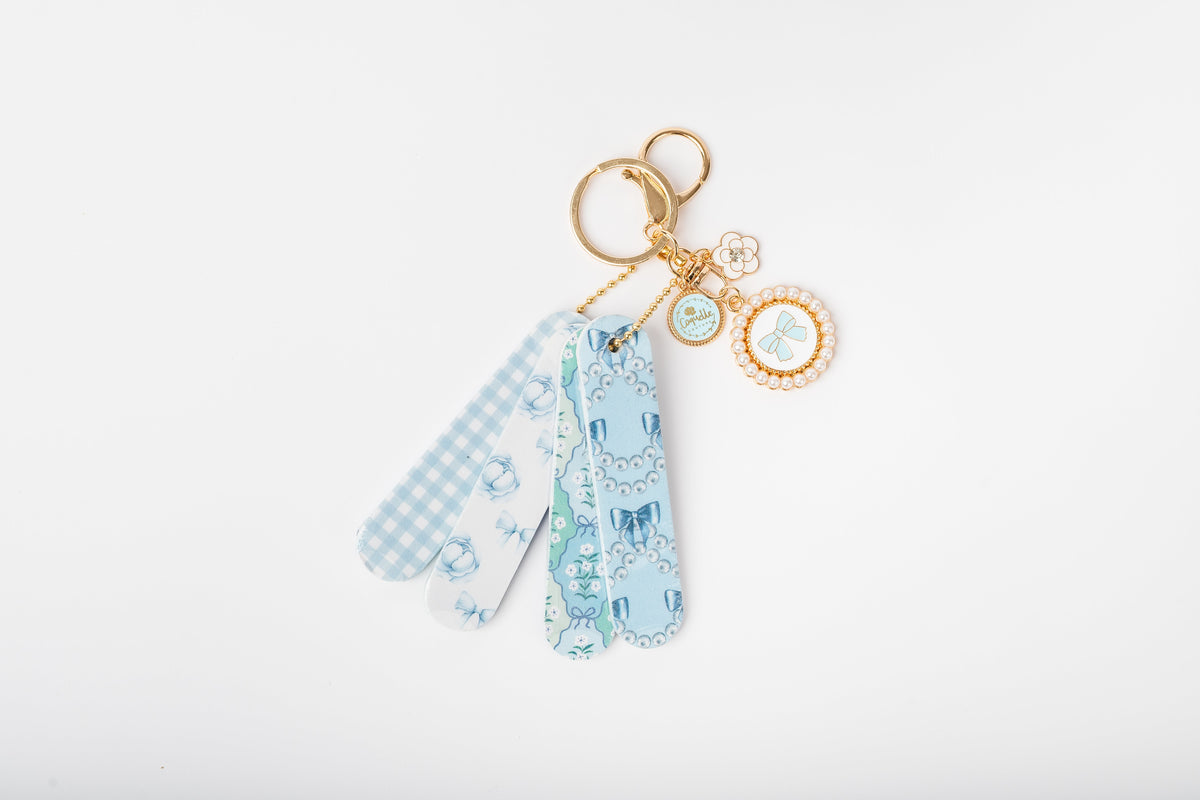 Coquette mini nail file keychain set COQ202, photographed outside its packaging to show the files and charms