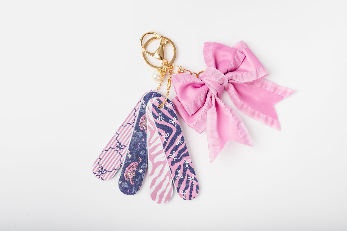 Coquette mini nail file keychain set COQ5264, photographed outside its packaging to show the files and charms