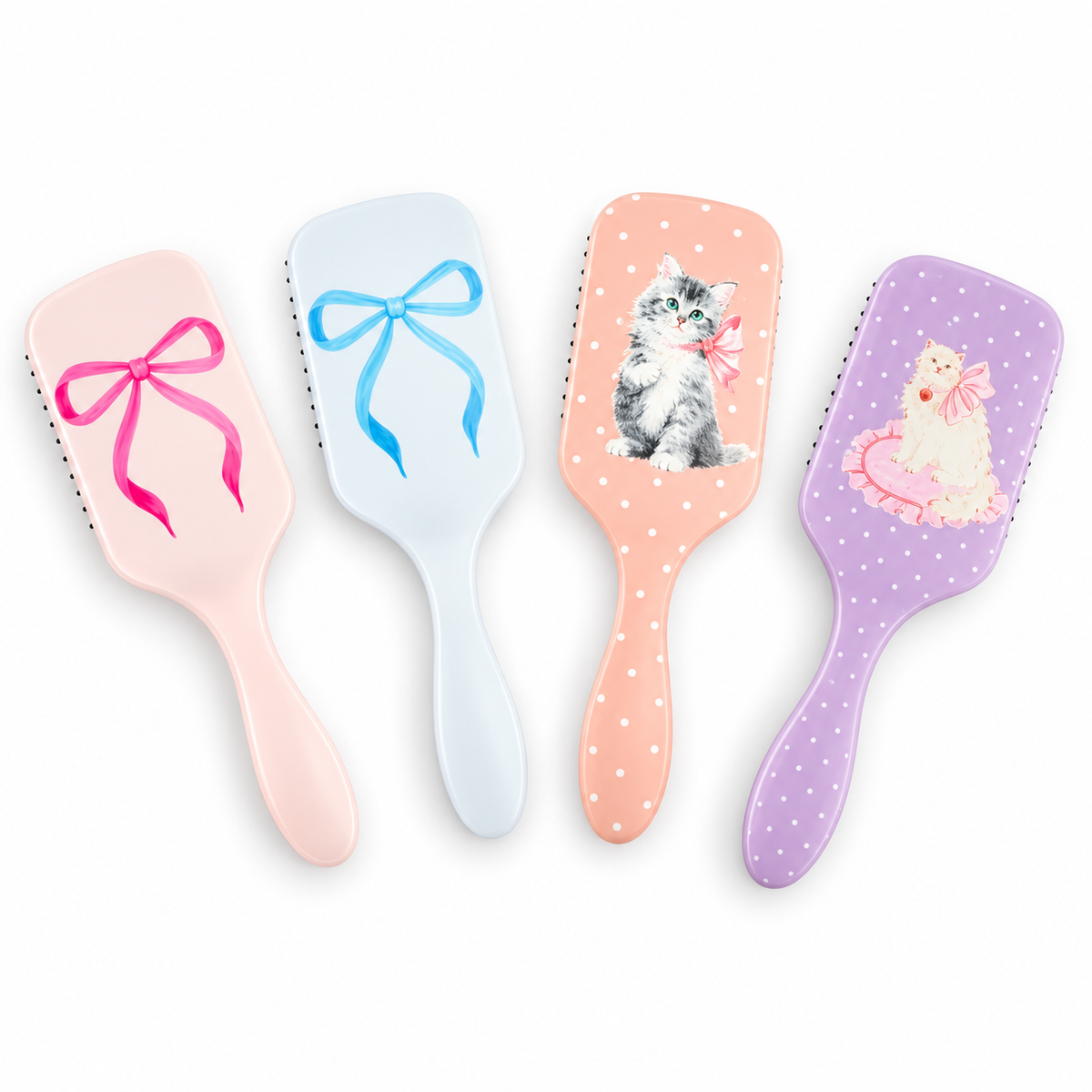 All four Coquette Couture paddle brush styles together