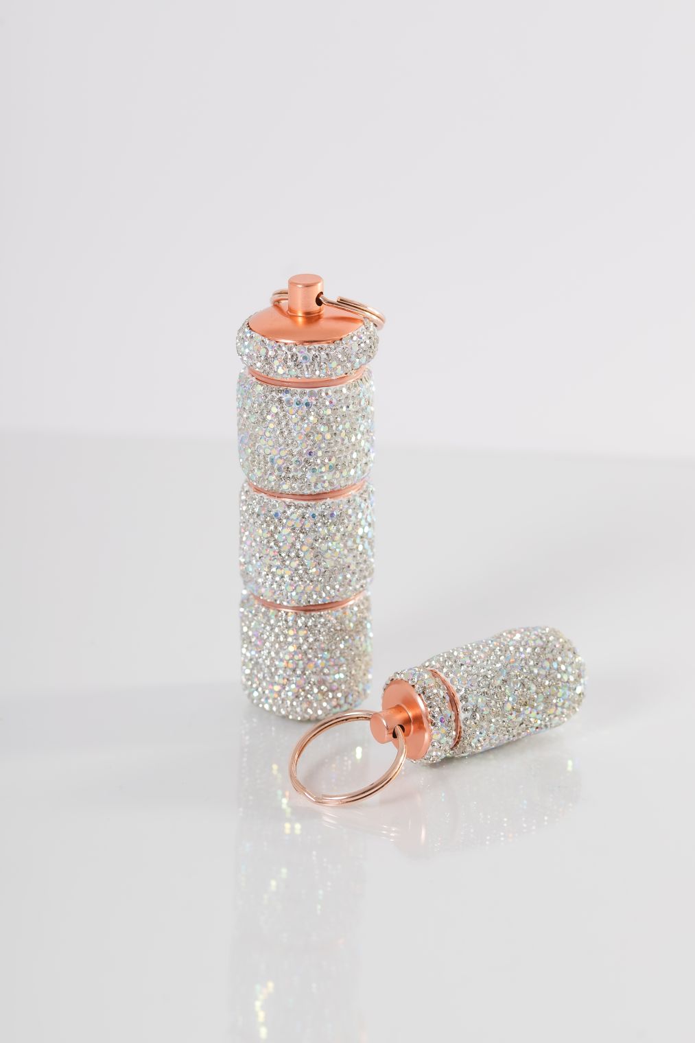 Silver pill case set with large and small keychain cases
