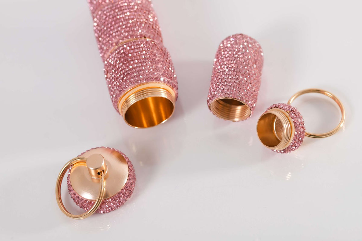 Ruby Pink pill cases opened to show their compartments