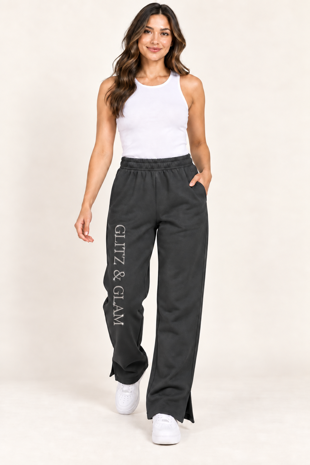 Model wearing Glitz & Glam open leg joggers in black, correctly oriented logo